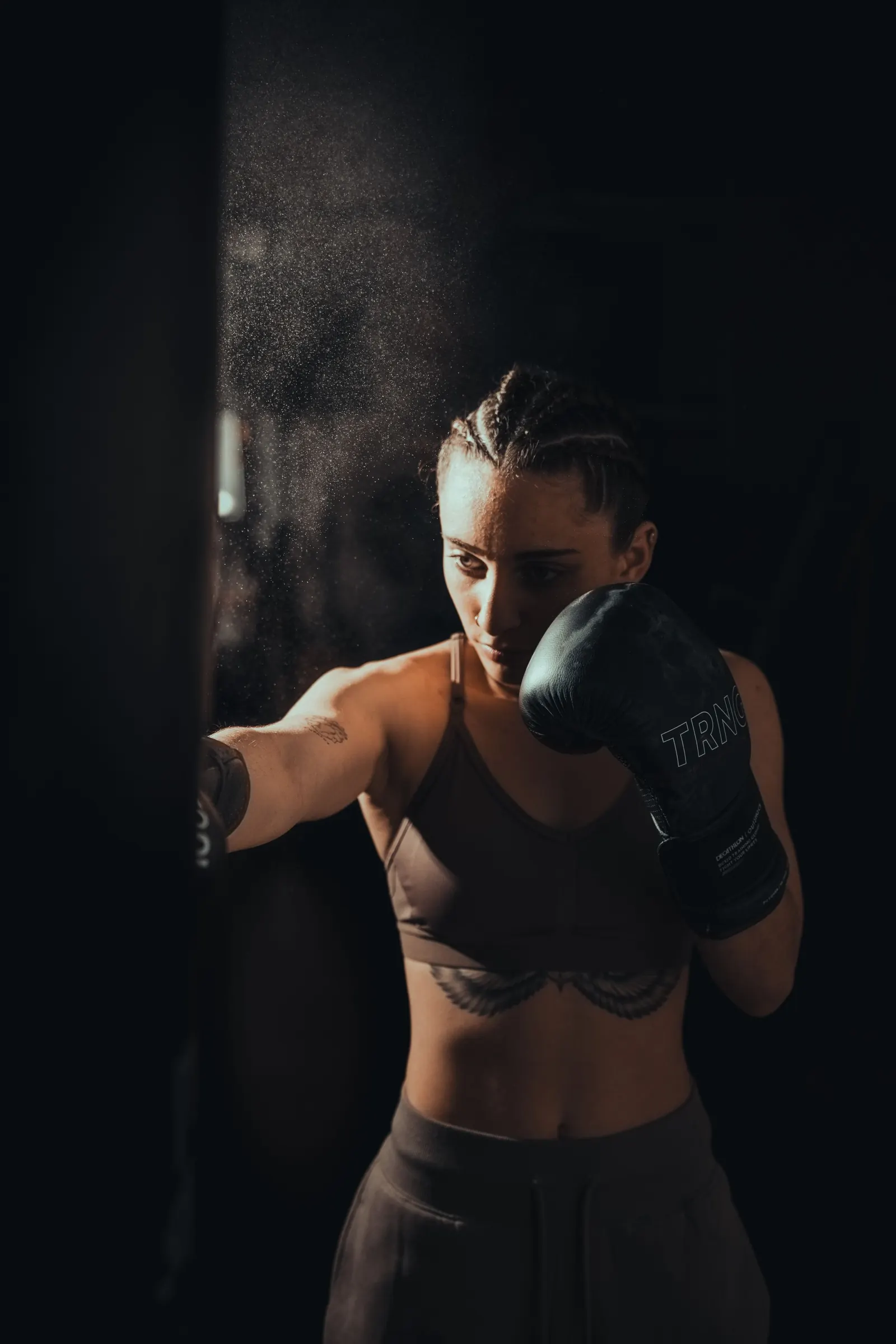 A woman training on a punching bag