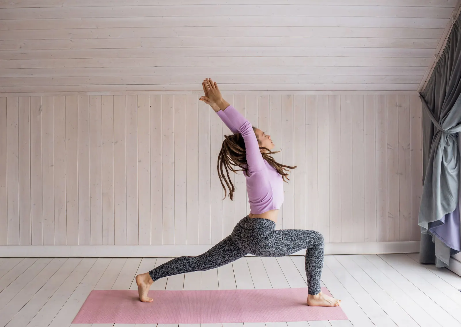 A woman stretching on a mat